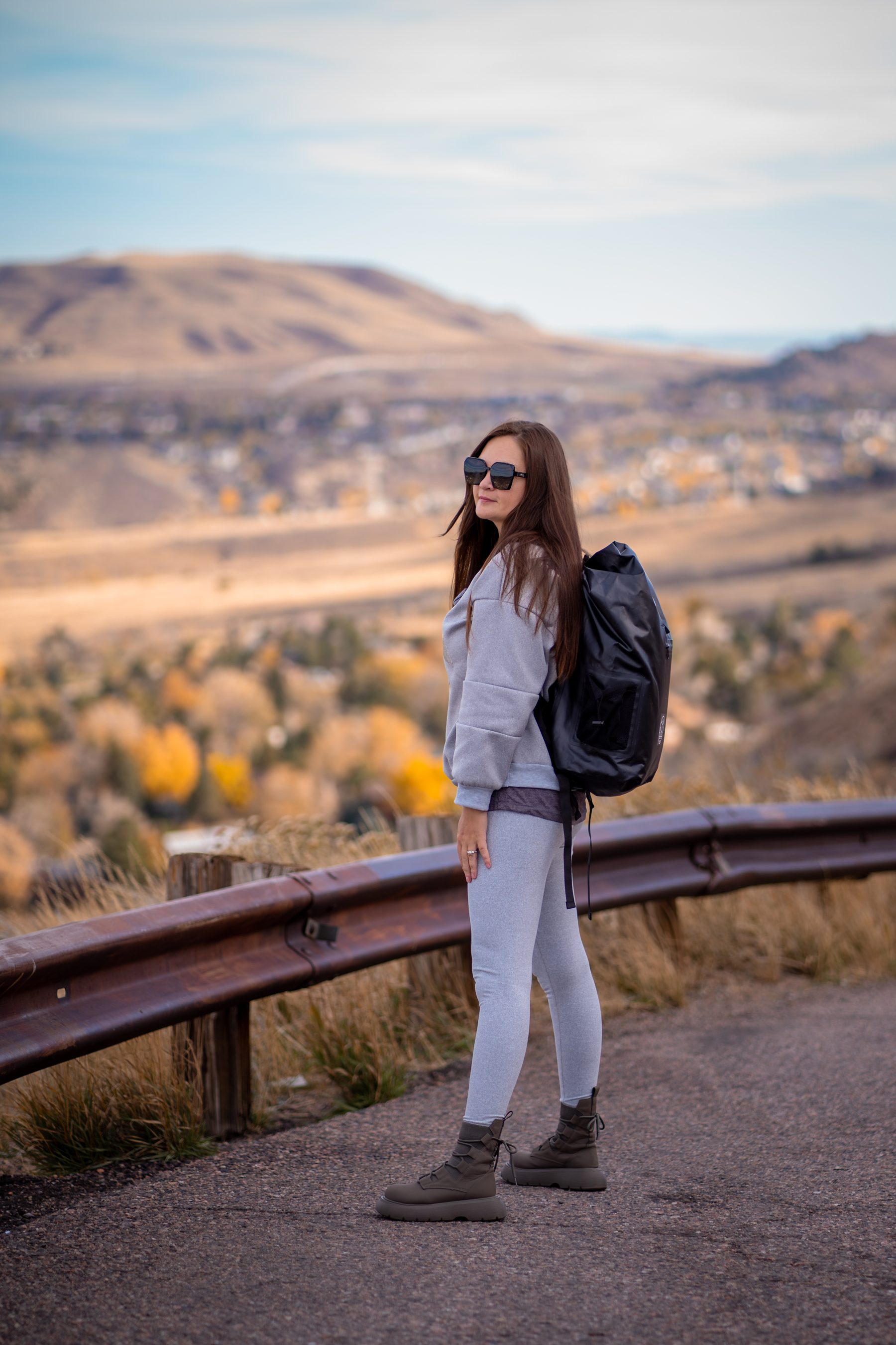 Model wearing a UNIKA waterproof backpack outdoors